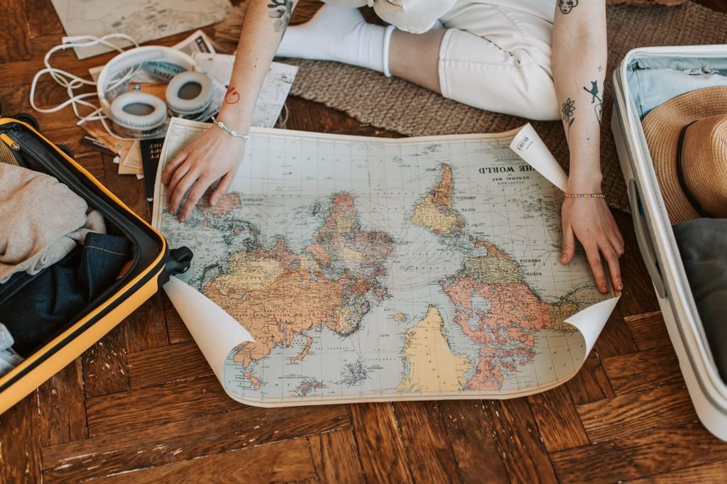 Traveler planning budget travel with a picturesque landscape view