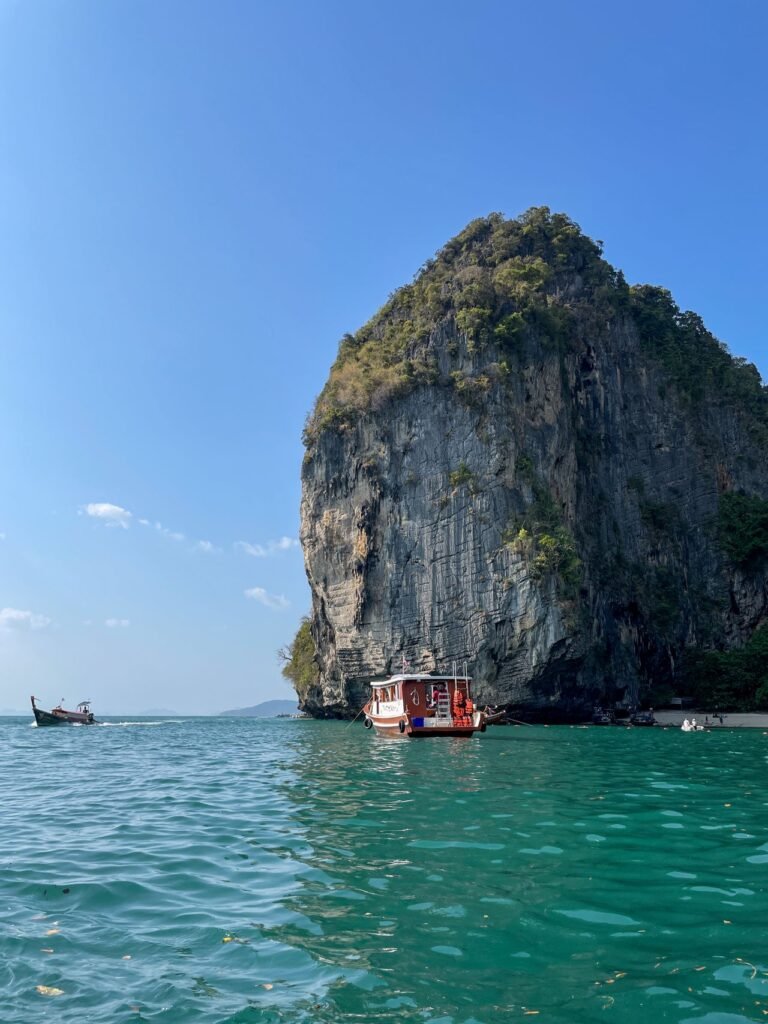 Southeast Asia travel guide
Limestone cliff with boats on turquoise waters in Ao Nang, Thailand.