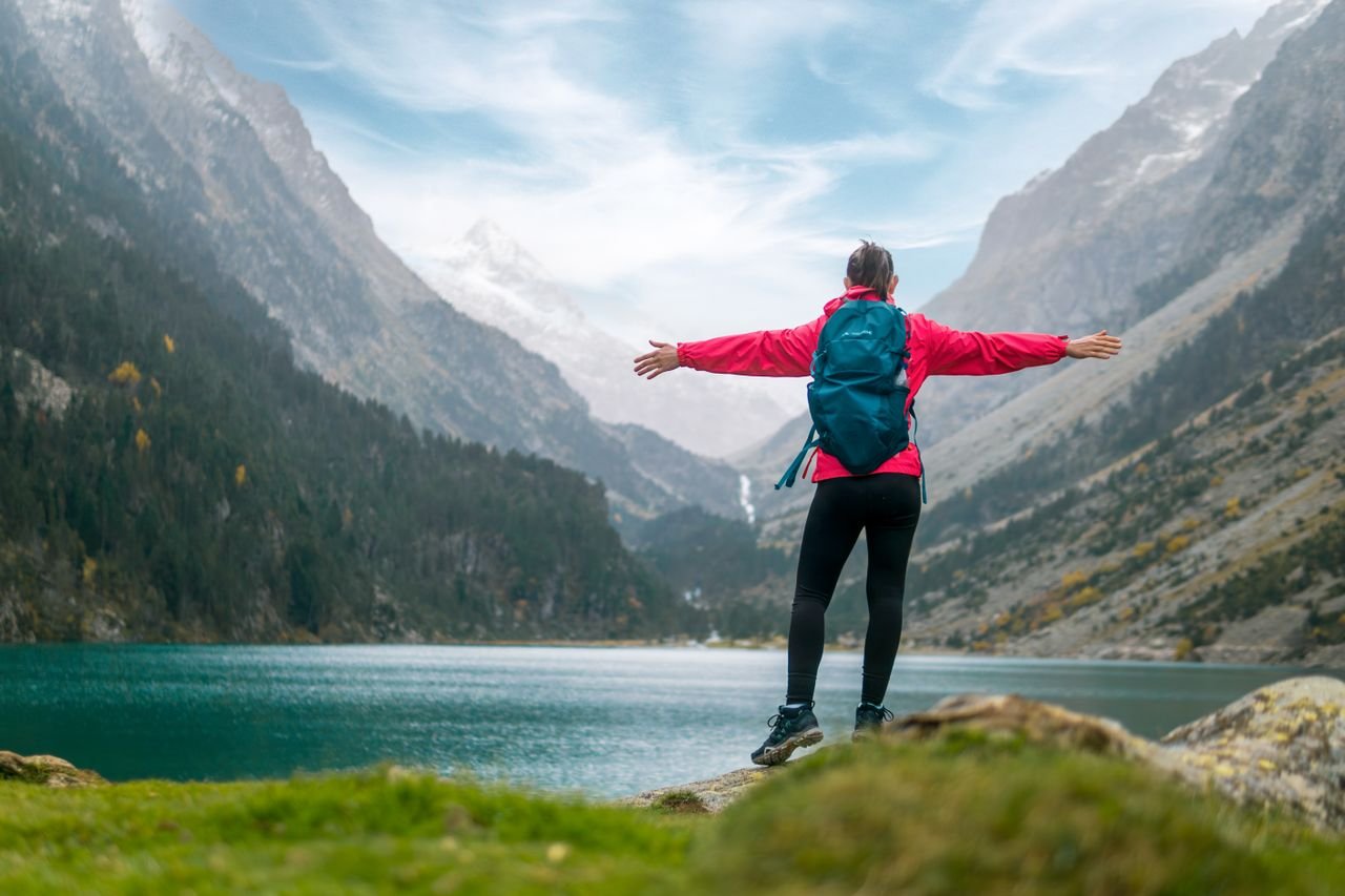 Solo Travel Solo travel adventure featuring an independent explorer overlooking a scenic landscape