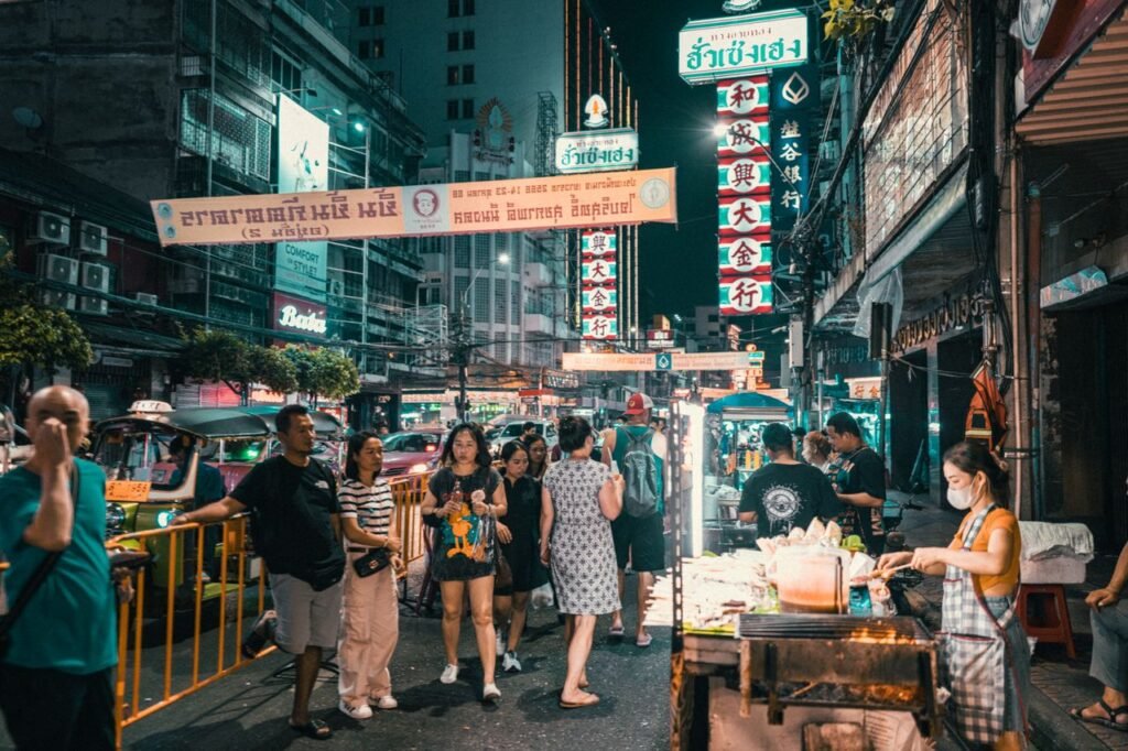 Food and Culture Travel Guide - Vibrant night market street food stall representing the food and culture travel guide